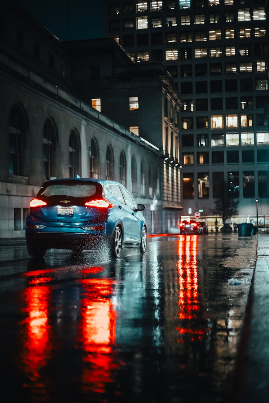 cars on street in rain at night